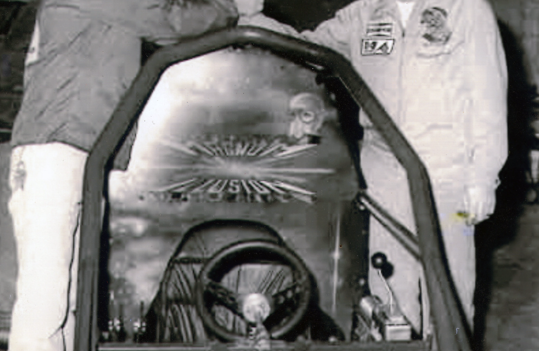 Close view of the painted cockpit panel showing Magnum Illusion lettering, the central starburst and helmeted portrait.